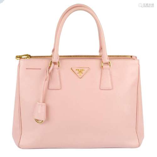 PRADA - a pink Saffiano leather handbag. Crafted from