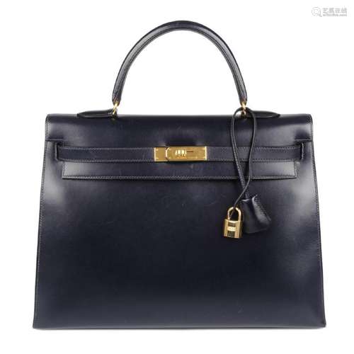 HERMÈS - a 1999 navy blue Box Calf Kelly Sellier 35