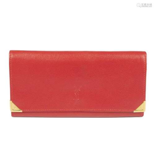 YVES SAINT LAURENT - a red Continental wallet. Crafted