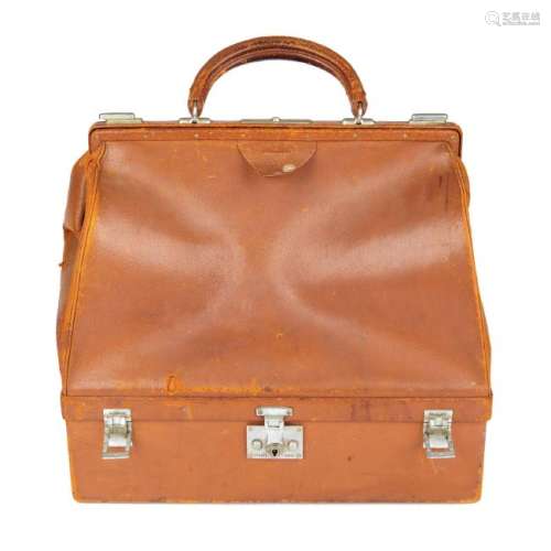 HERMÈS - a vintage leather doctor bag. Featuring a tan