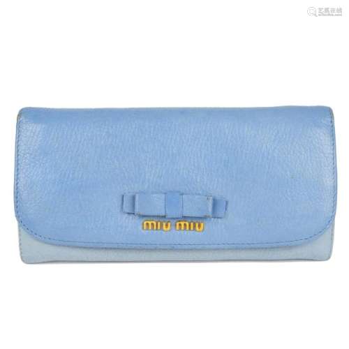 MIU MIU - a Bow wallet. Crafted from two-tone baby blue