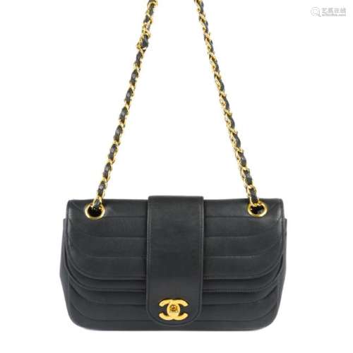 CHANEL - a horizontal quilted double flap handbag.