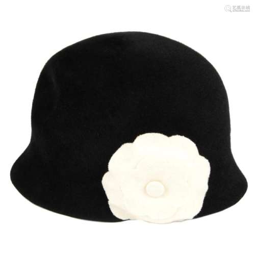 CHANEL - a black Camellia Cloche hat. Designed with a
