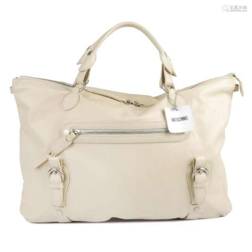 MOSCHINO - a large cream leather handbag. Crafted from