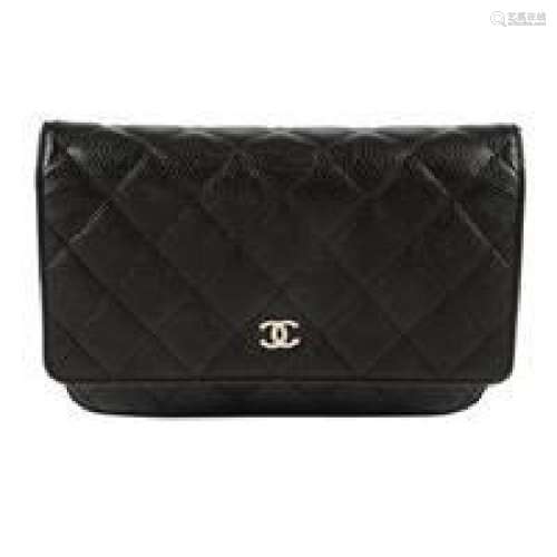 CHANEL - a black leather Wallet On Chain handbag.