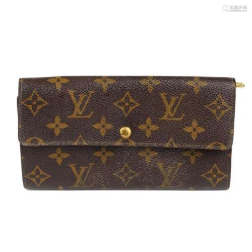 LOUIS VUITTON - a Monogram long wallet. Crafted from