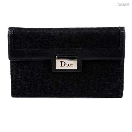 CHRISTIAN DIOR - a black wallet. Designed with maker's