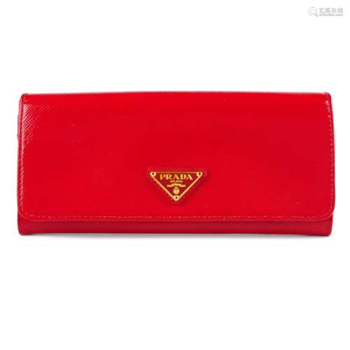 PRADA - a red Saffiano continental wallet. Designed