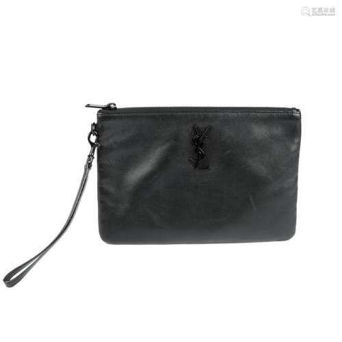 YVES SAINT LAURENT - a black leather clutch. Crafted