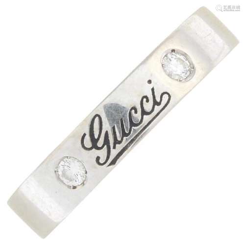 GUCCI - an 18ct diamond band ring. Designed as a plain