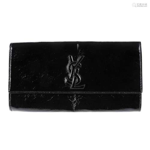 YVES SAINT LAURENT- a patent leather clutch. Featuring