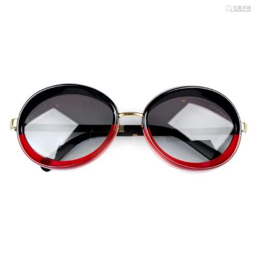 CHANEL - a pair of sunglasses. Designed with oval dark