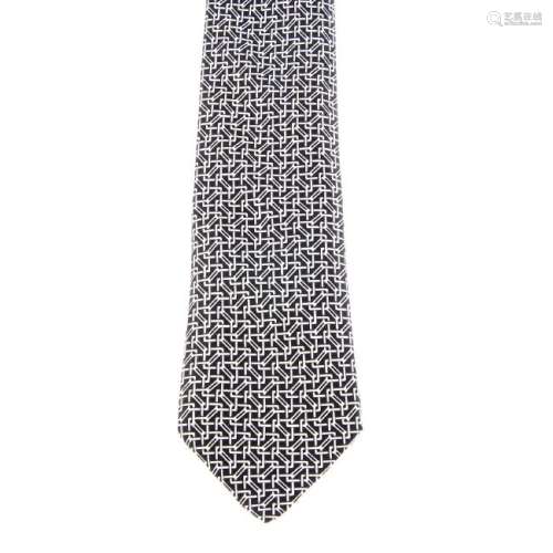 HERMÈS - a silk tie. Featuring a black and white