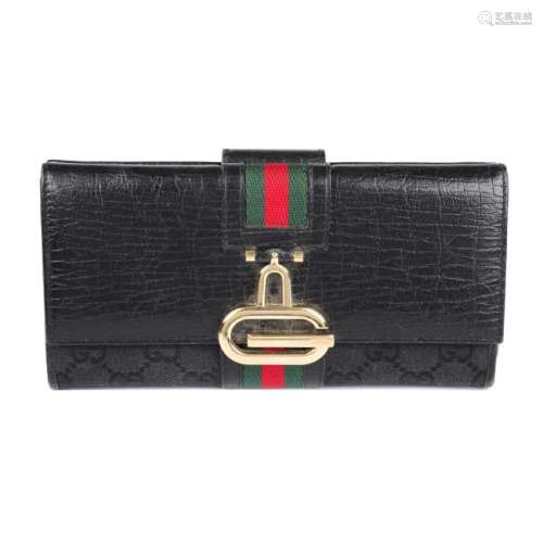 GUCCI - a vintage Web long wallet. Designed with a GG
