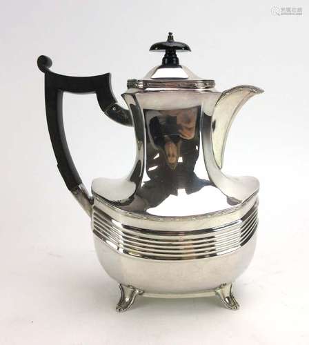 An early 20th century silver coffee pot of vase shaped form with tied border decoration,