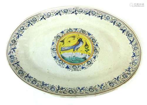 A Continental faience charger of oval form,