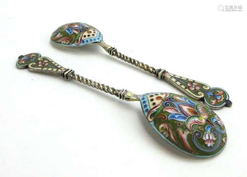 A pair of early 20th century Russian silver and parcel gilt spoons decorated in cloisonne enamel