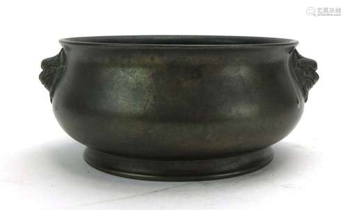 A Chinese brown patinated bronze censer of typical form with masque handles, character mark to base,