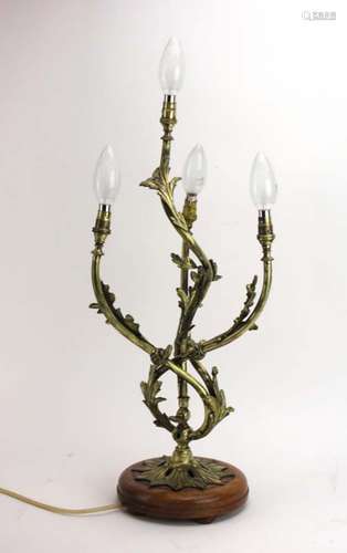 A late 19th/early 20th century gilt brass three branch table lamp, converted from gas,