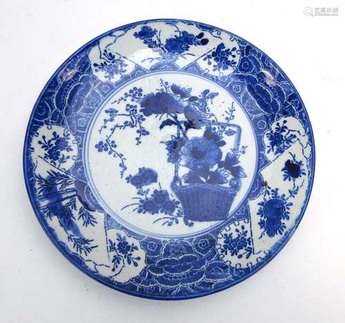 A late 18th/early 19th century Japanese blue and white charger of circular form,