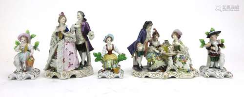 A Continental figural group modelled as a dandy and his female companion, h.