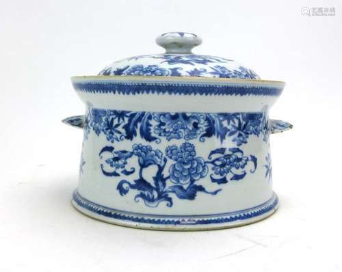 A Chinese blue and white two handled covered dish decorated with blossoming shrubs, w. 23.