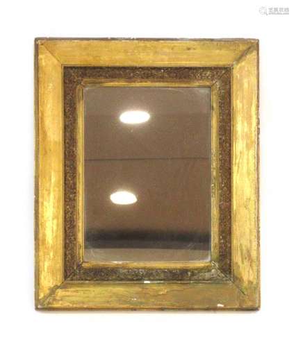 A 19th century gilt plaster wall mirror of rectangular form,