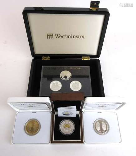 A group of silver coins including the 2011 Royal Wedding £5 three coin set,