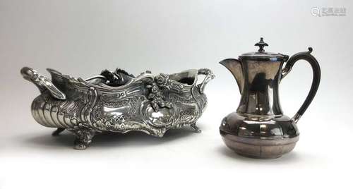 A silver plated two handled table centre of boat shaped form decorated in the rococo manner, w.