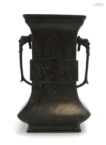 An 18ct century Chinese brown patinated bronze two handled vase decorated with stylised leaves and