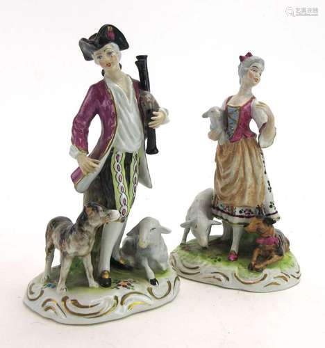 A pair of 18th century-style figures modelled as a piper and his female companion,