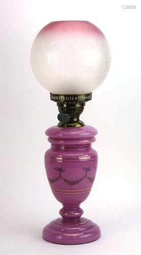 A pink opaline glass oil lamp by Duplex with an opaque and decorative shade CONDITION