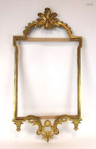 A Classical-type wall mirror with a gilt metal frame surmounted by a scrolled pediment,