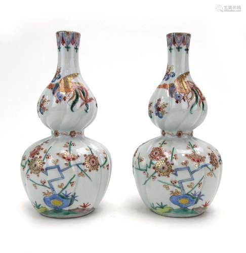 A pair of late 18th/early 19th century Japanese Kakiemon bottle vases of double gourd form,