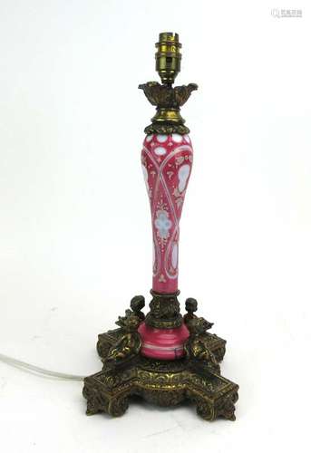 An early/mid 20th century pink Bohemian glass and gilt metal mounted table lamp, h.