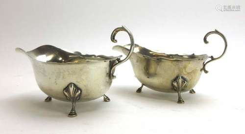 A pair of silver sauce boats of typical form with hoof feet, Adie Brothers, Birmingham 1930,