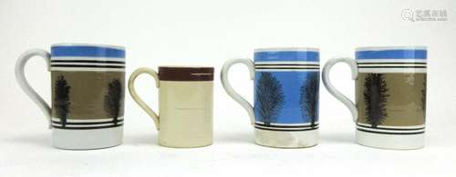 Three Mocha ware tankards, each decorated with a silhouette of a tree, h. 12.