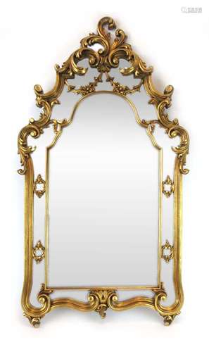 A 20th century wall mirror with moulded gilt frame and swag pediment,