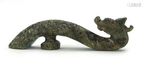 A Chinese mottled green jade belt buckle in the form of a dragons head, w.