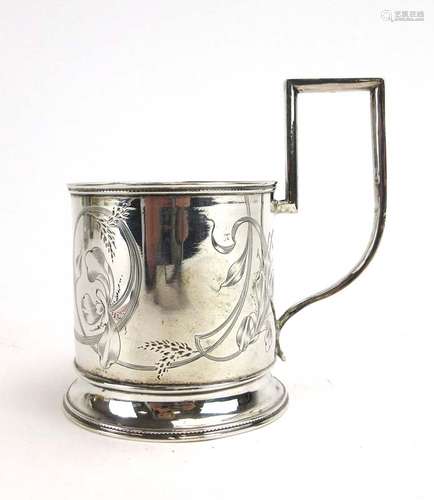 An early 20th century Russian silver tea glass or podstakannik holder of typical form,