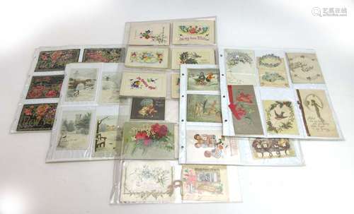 An album of approximately one hundred and ninety early 20th century Christmas and greetings cards,