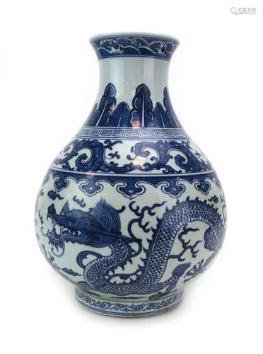 A Chinese blue and white vase of globular form decorated with a pair of dragons, h.