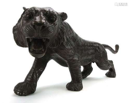 A brown patinated bronze figure modelled as an outstretched tiger, signed A. Toit, l.