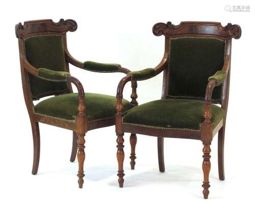 A pair of 19th century mahogany and upholstered armchairs on turned front legs