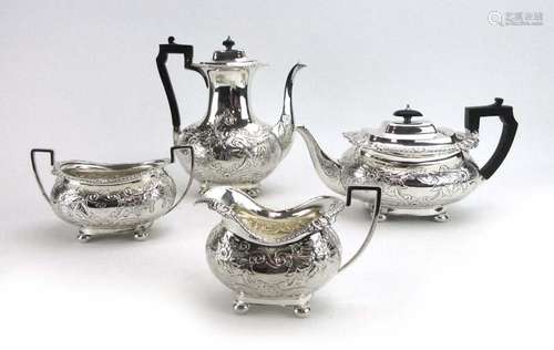 A late Victorian four piece tea service of vase shaped form,