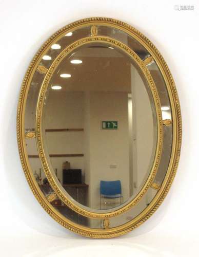 A late 19th/early 20th century gilt and panelled wall mirror,