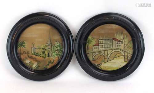 A pair of circular 19th century woolwork pictures depicting bridges and a spire, d.