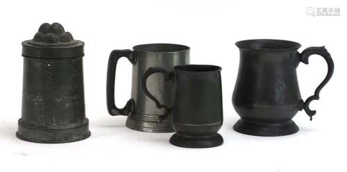 A group of pewter including a jelly mould and three tankards