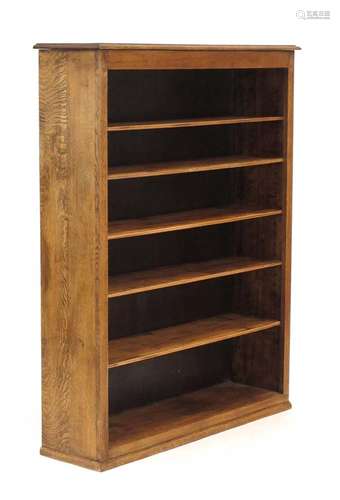 An early 20th century oak open-fronted adjustable bookcase on a plinth base, w.