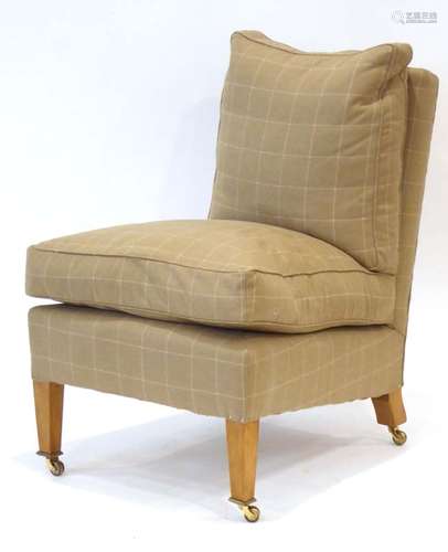 A contemporary 'Marlborough' lounge chair upholstered in caramel loosely chequered fabric,